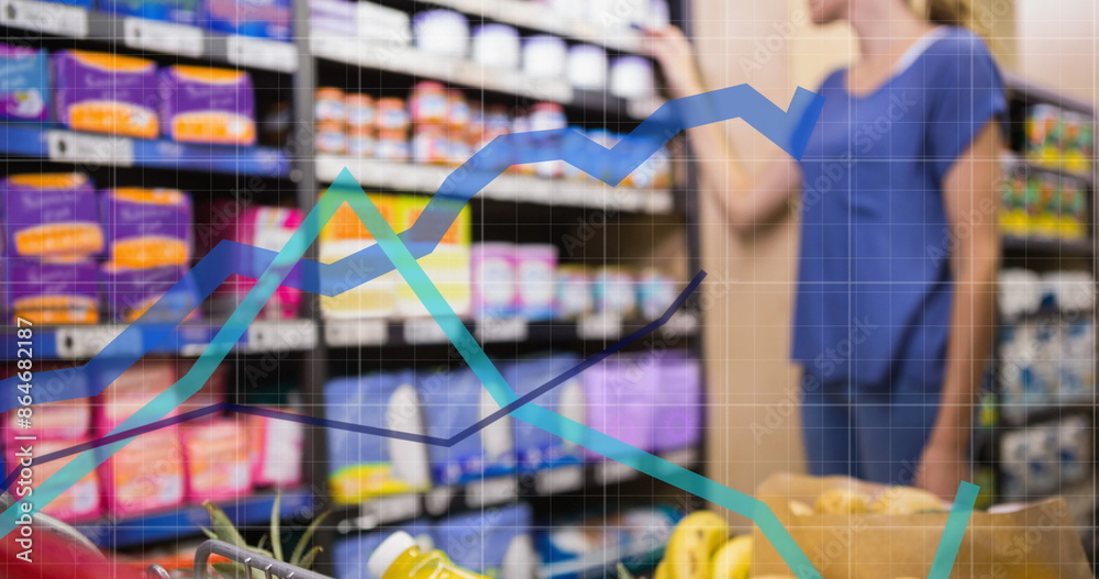 Image of data processing over caucasian woman with trolley in shop Image of data processing over caucasian woman with trolley in shop