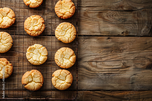 Butter cookies on a wire rack over a wooden table