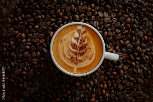 Beautiful latte, coffee beans background, in a cozy coffee shop
