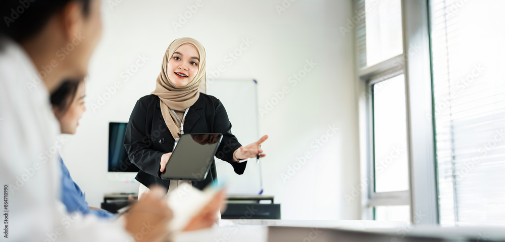 Asian team of business people working with business data analytics on laptop at office, Business presentation or seminar concept. Asian team of business people working with business data analytics on laptop at office, Business presentation or seminar concept.
