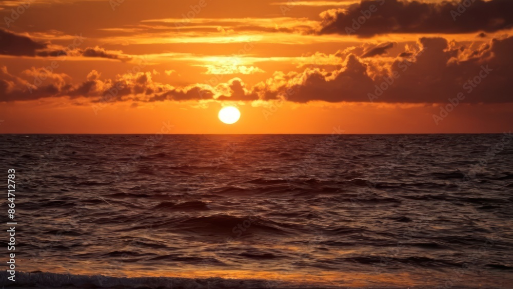 a photograph of the sun is setting over the ocean on a clear day with clouds in the sky a photograph of the sun is setting over the ocean on a clear day with clouds in the sky