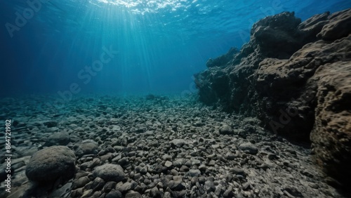 a photograph of an underwater view of a rocky beach with rocks and water underneath the water's surface