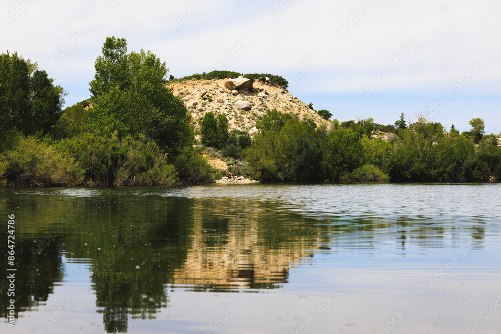 Scenic Lake with Reflections of Trees and Hill in Wilderness Scenic Lake with Reflections of Trees and Hill in Wilderness
