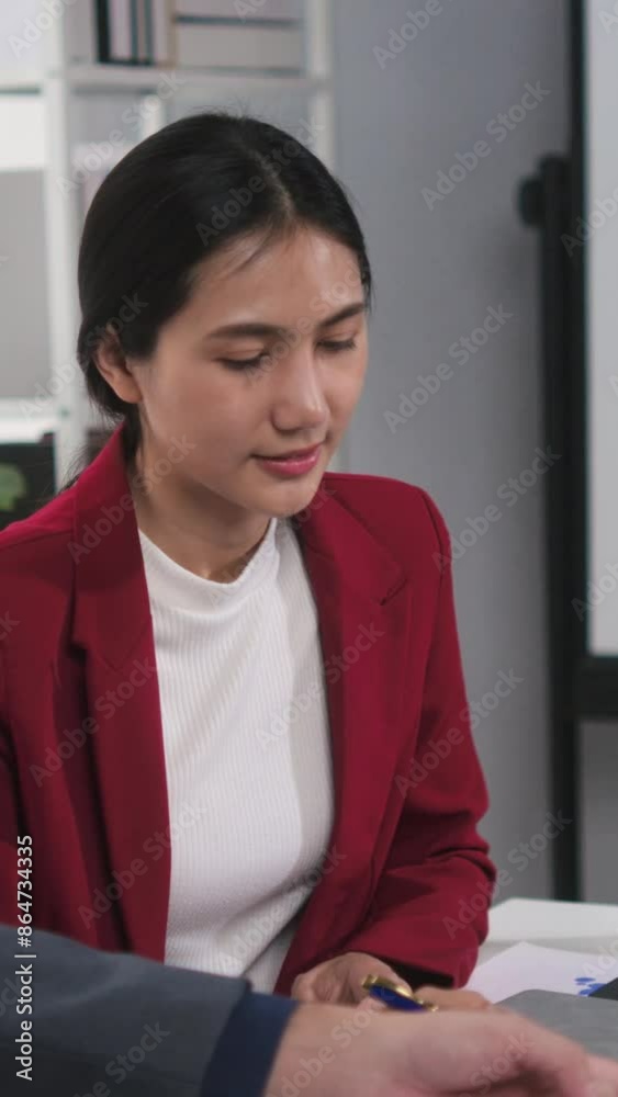 Professional businesswoman actively engages in discussing charts and graphs with a colleague during a meeting, showcasing strong communication skills and teamwork in a corporate environment Professional businesswoman actively engages in discussing charts and graphs with a colleague during a meeting, showcasing strong communication skills and teamwork in a corporate environment