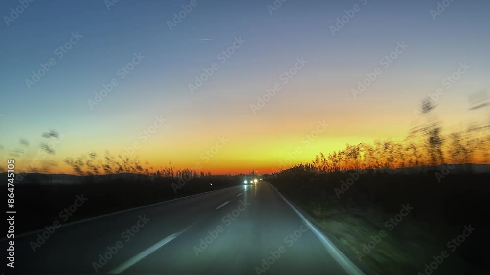 Rural road drive pov with amazing breathtaking sunset at background. Concept of travel, vacation Rural road drive pov with amazing breathtaking sunset at background. Concept of travel, vacation