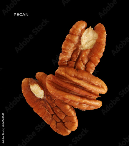 Creative layout made of pecan nuts on the black background. Food concept. Macro concept.	 photo