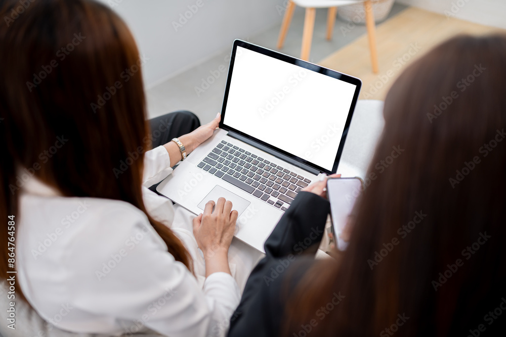 Business Team uses laptop to analyze data to trade stocks on the stock exchange Business Team uses laptop to analyze data to trade stocks on the stock exchange