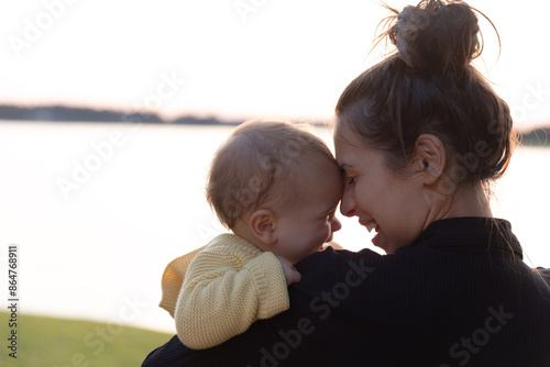 Mother and young daughter smiling - close up on faces-alt 