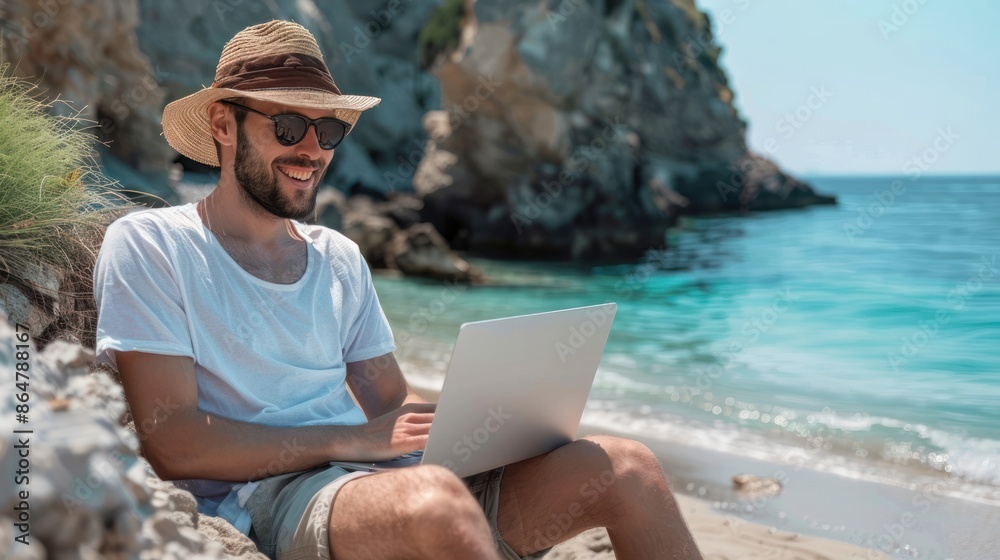 Photo of happy Young Man using laptop at the beach Photo of happy Young Man using laptop at the beach