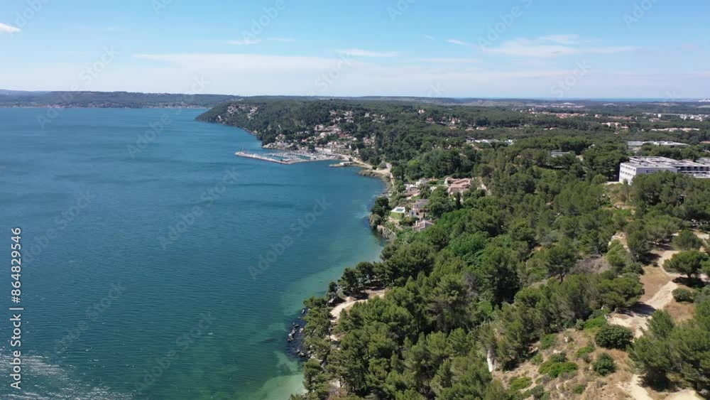 Aerial view drone video flying from the air over the picturesque sea coast of the south of France, Provence, Istres at bright sunny summer day Aerial view drone video flying from the air over the picturesque sea coast of the south of France, Provence, Istres at bright sunny summer day