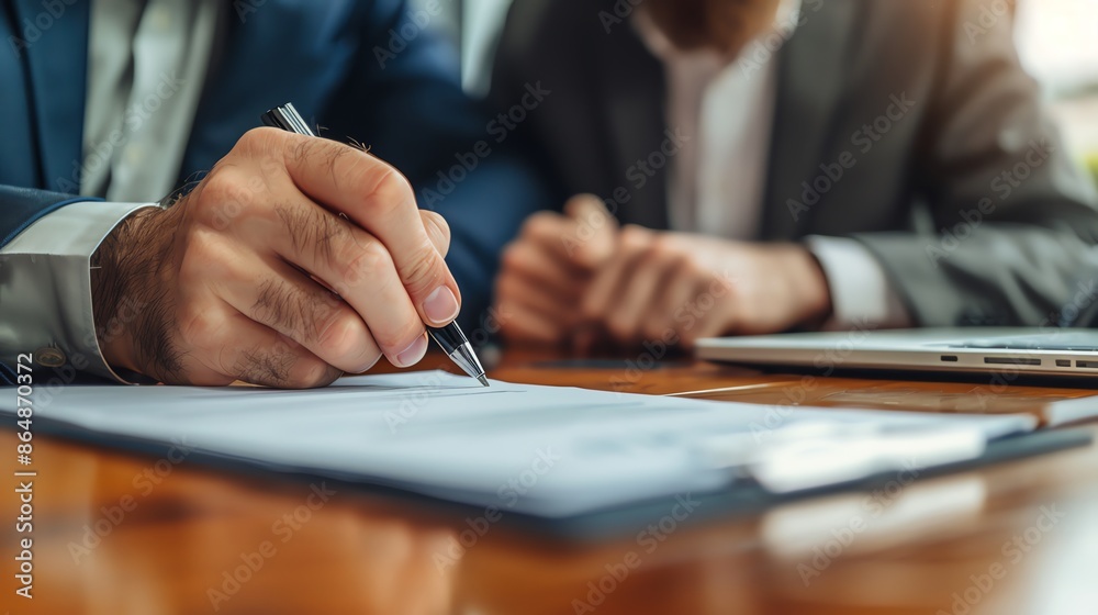 Business partners signing a partnership agreement, contract signing, formal partnership Business partners signing a partnership agreement, contract signing, formal partnership