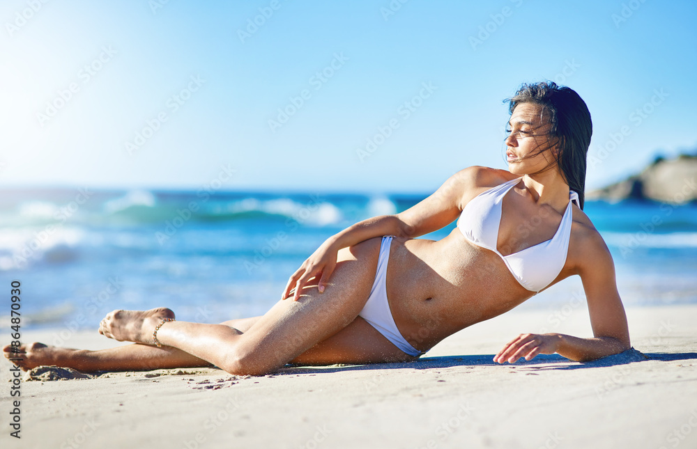 Confident, woman and bikini relax on beach for summer holiday, peace or tropical ocean travel in Australia. Pride, female person and sand with swimwear for beauty, freedom and adventure journey Confident, woman and bikini relax on beach for summer holiday, peace or tropical ocean travel in Australia. Pride, female person and sand with swimwear for beauty, freedom and adventure journey