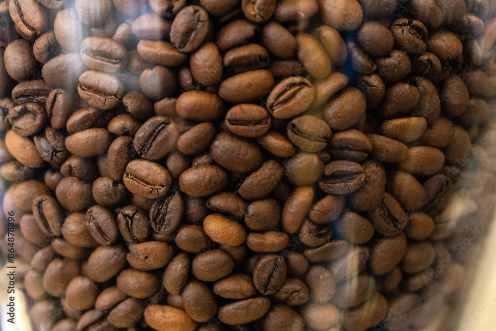 Fototapeta premium roasted coffee beans in the glass 