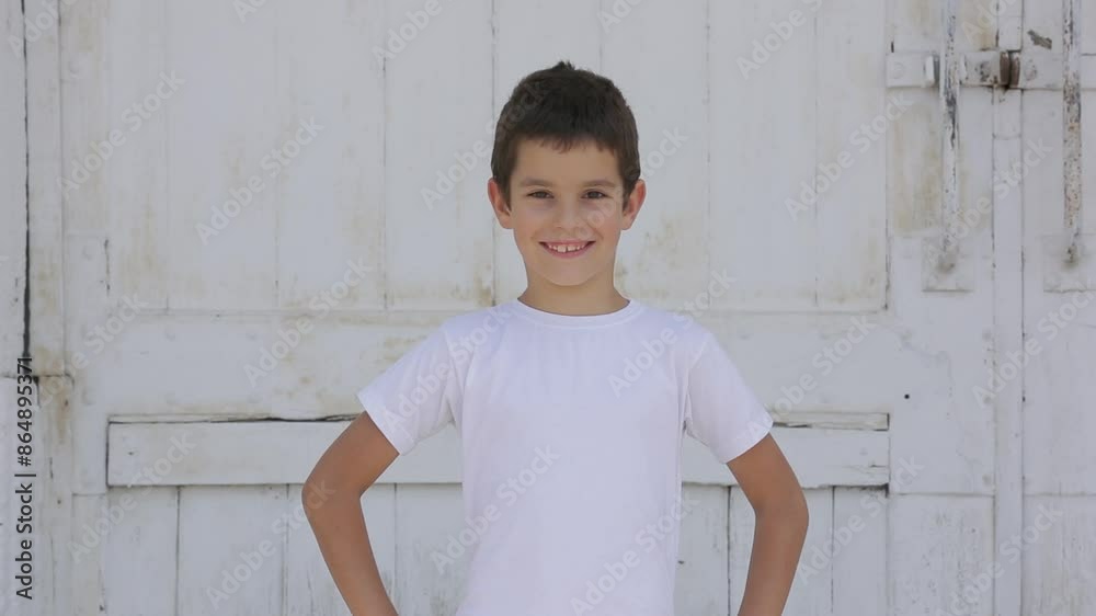 Preschool child boy looking at camera and start to smile, outside. Preschool child boy looking at camera and start to smile, outside.