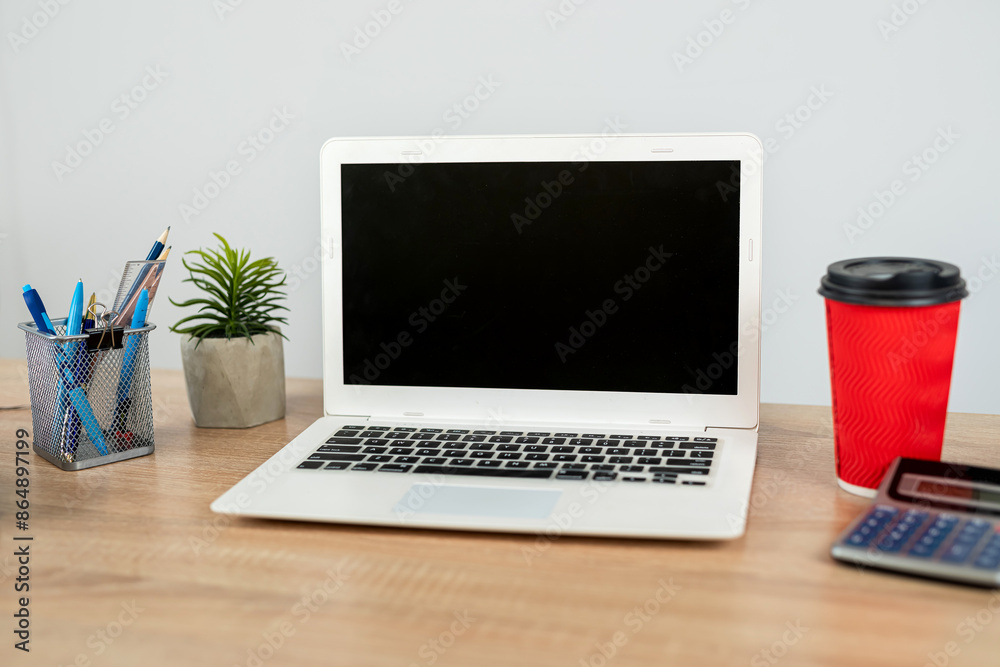 Empty notepad with pen laptop calculator coffee on a office wooden surface, nobody. Empty notepad with pen laptop calculator coffee on a office wooden surface, nobody.