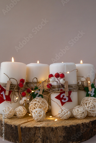 Four Advent candles calendar with Christmas zero waste decorations. Holiday preparation copy space for text. Catholic traditions of Christmas countdown new year winter holidays  photo