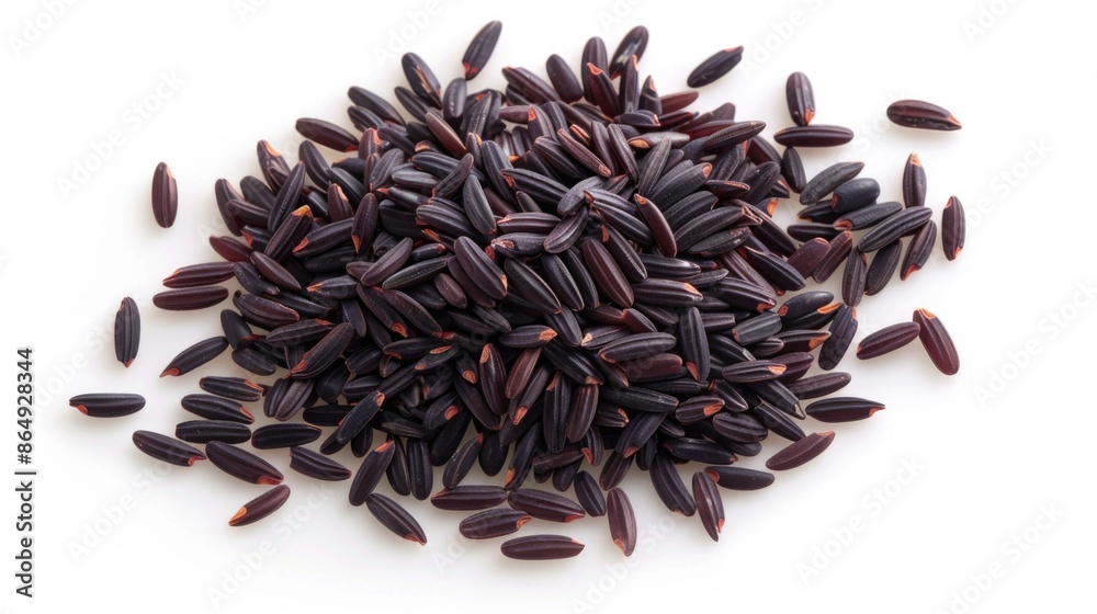 A pile of black rice on a white surface, useful for food or still life compositions A pile of black rice on a white surface, useful for food or still life compositions