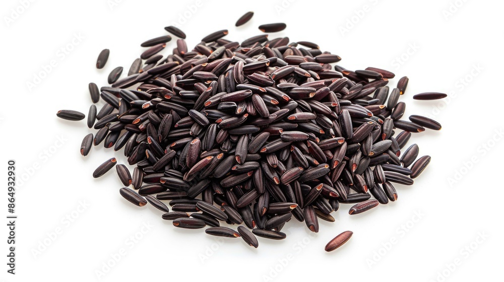 A close-up shot of a pile of black rice grains on a white surface, great for food-related compositions A close-up shot of a pile of black rice grains on a white surface, great for food-related compositions