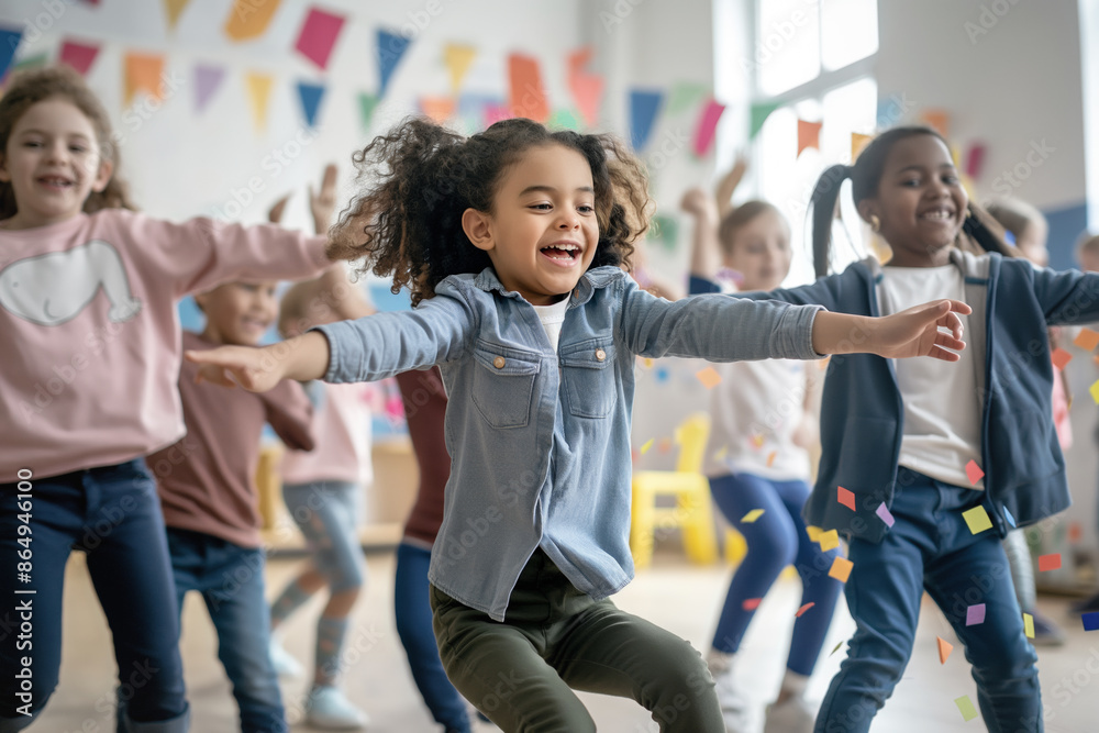 Obraz premium Excited children dancing and playing with confetti in a decorated room filled with colorful banners. Joyful atmosphere highlights the fun and energy of a lively party