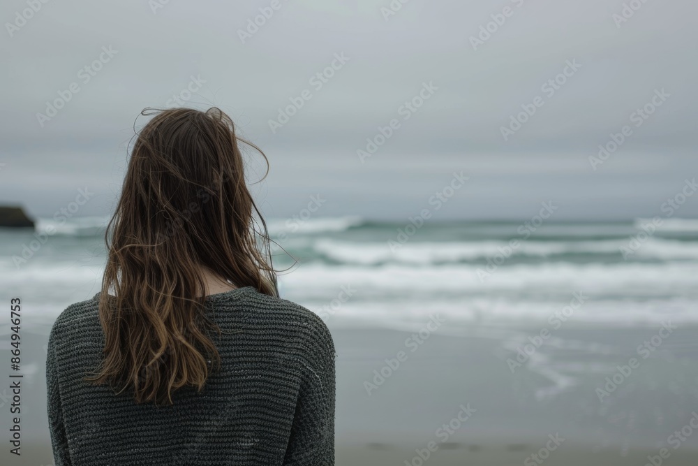Serene seaside reflection with thoughtful woman gazing at ocean waves Serene seaside reflection with thoughtful woman gazing at ocean waves