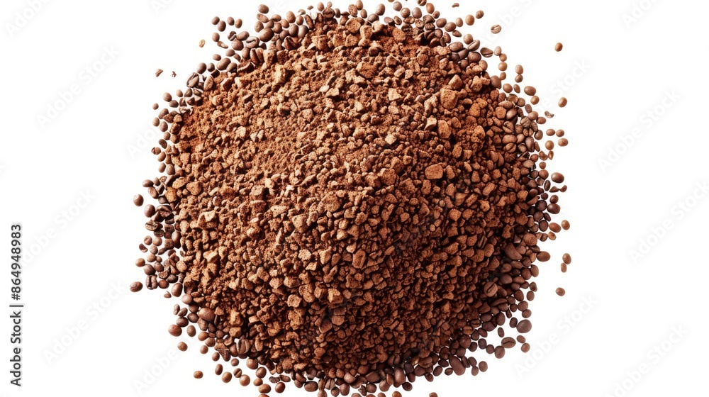 A pile of coffee beans on a white surface A pile of coffee beans on a white surface