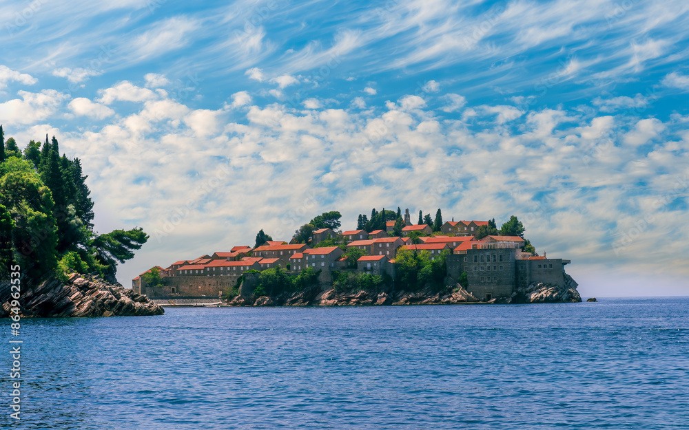 beautiful summer landscape of amazing resort on amazing island with yellow ancient walls and orange tile roofs among sea vawes and nice blue sky on background beautiful summer landscape of amazing resort on amazing island with yellow ancient walls and orange tile roofs among sea vawes and nice blue sky on background