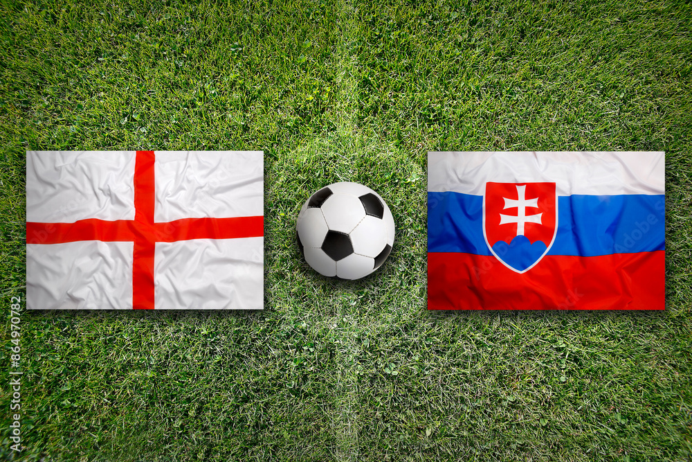 England vs. Slovakia flags on soccer field or football field England vs. Slovakia flags on soccer field or football field