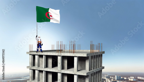 A construction worker proudly raises the Algeria flag atop a new building, symbolizing progress and the construction of new real estate