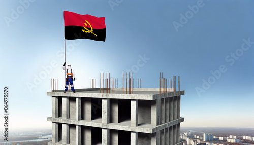 A construction worker proudly raises the Angola flag atop a new building, symbolizing progress and the construction of new real estate