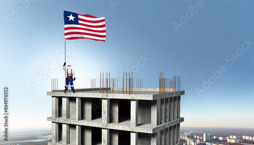 A construction worker proudly raises the Liberia flag atop a new building, symbolizing progress and the construction of new real estate