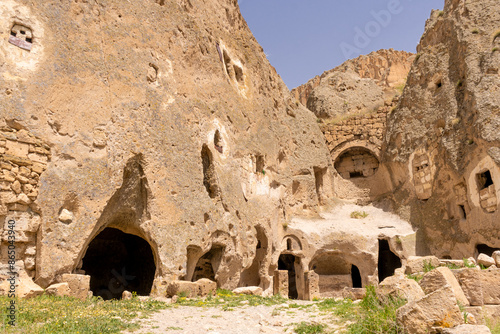 Türkiye Cappadocia Fairy Chimneys as Peri Bacalari. Volcanic rock landcsape of Fairy tale chimneys in Cappadocia with blue sky on background in Goreme, Nevsehir