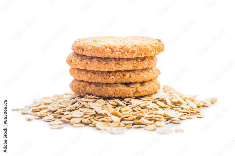 Tasty oatmeal cookies and rolled oat isolated on white background. Tasty oatmeal cookies and rolled oat isolated on white background.