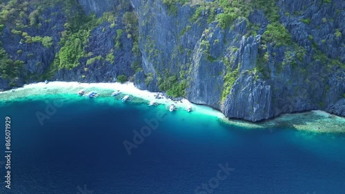 Aerial footage of Talisay Beach on a sunny day in Tapiutan Island, El Nido, Palawan, Philippines photo