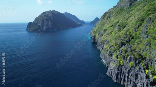 Aerial view of the coastal cliff of Matinloc Island on a sunny day in El Nido, Palawan, Philippines photo