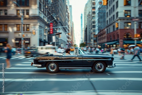 A black car cruising down a street lined with tall buildings in an urban setting, A vintage convertible cruising through a bustling city street