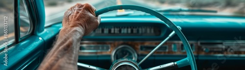 Hand on Steering Wheel of a Classic Car.