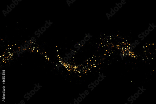 Scattered gold particles on a black background. Festive background or design element.
