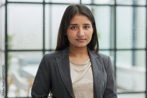 Closeup portrait of a young business woman in her office