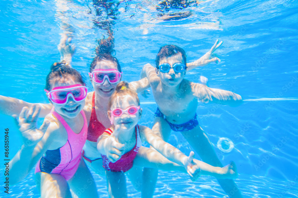 family swimming in pool