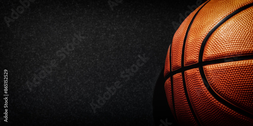 Dark web banner with detailed orange basketball and copy space for text. Professional sports backgrounds