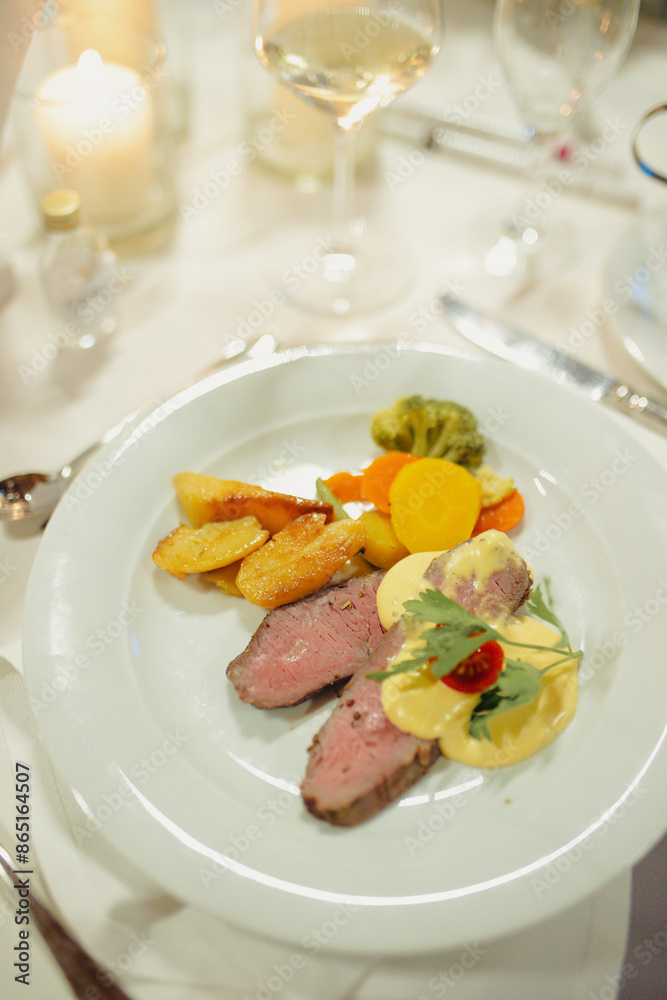 plate with food (meat and vegetables)