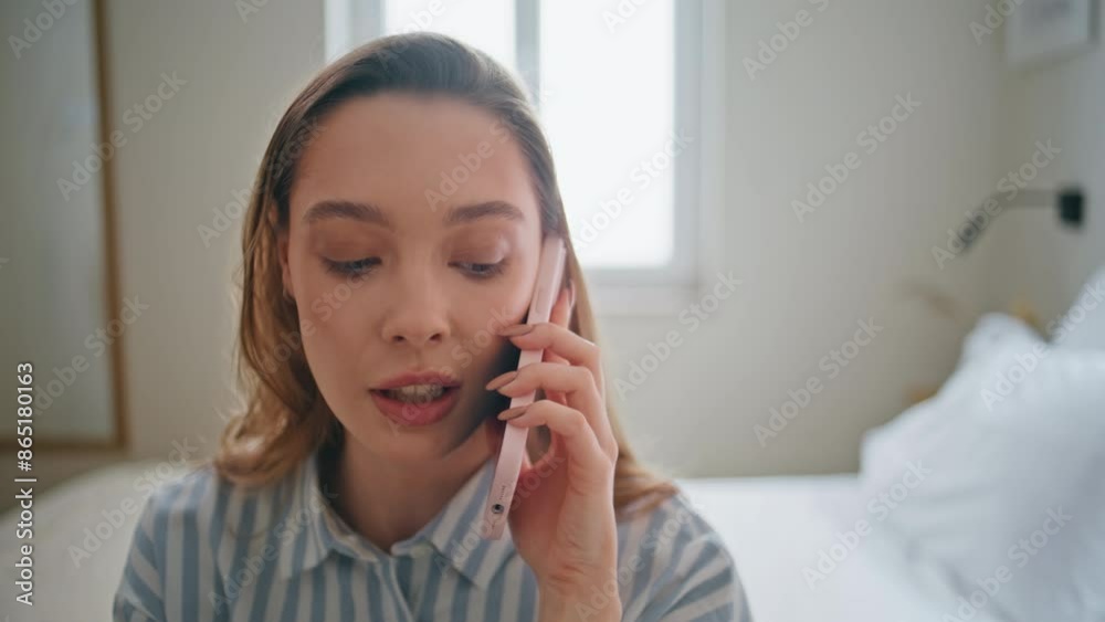 Portrait girl speaking cellphone sitting comfortable white bed. Woman calling Portrait girl speaking cellphone sitting comfortable white bed. Woman calling