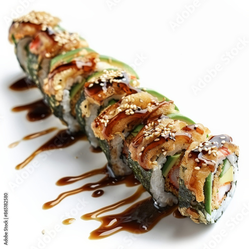 A beautifully presented platter of dragon roll sushi with shrimp tempura and avocado, topped with eel sauce and sesame seeds, isolated on white background.