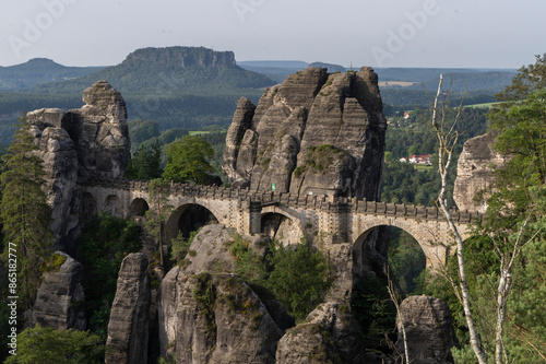 Landscape shot in the morning in a rocky landscape. On and around the Bastei Bridge in the Elbe Sandstone Mountains near Dresden, Saxony, Germany photo