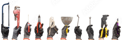 Fotografía Ten hands wearing safety gloves hold different home work tools on a white background