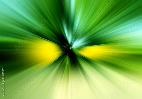 Abstract radial zoom blur surface in green and yellow tones. Bright and juicy green background with radial, radiating, converging lines.