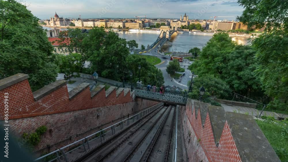 Budapest, Hungary - May 10, 2024: Buda Castle's Hill Funicular. Time-lapse, slide transition. Parliament building and chain bridge on the background. Budapest, Hungary - May 10, 2024: Buda Castle's Hill Funicular. Time-lapse, slide transition. Parliament building and chain bridge on the background.