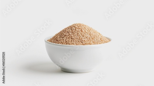 A photo of psyllium husk powder arranged in a zen-like pattern in a white bowl