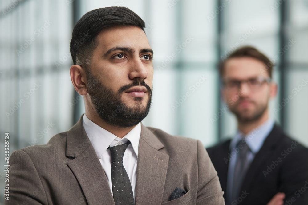 Portrait male worker looking at camera, positive employee posing for company business directory with co-workers Portrait male worker looking at camera, positive employee posing for company business directory with co-workers