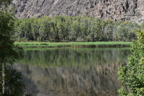 The stunning turquoise lake Iskanderkul and surrounding mountains and valleys in Tajikistan, Central Asia